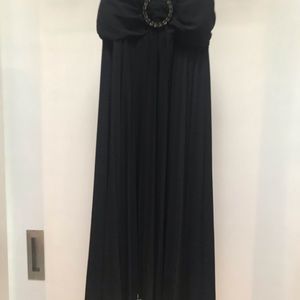 Black strapy party dress with jeweled broach